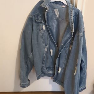 Oversized and distressed denim jacket